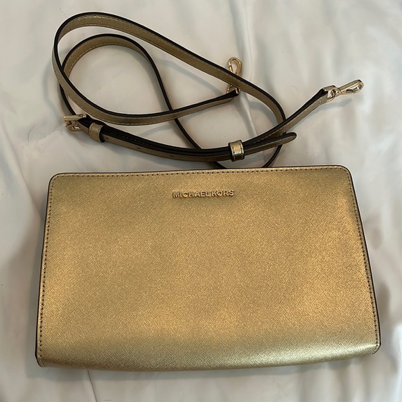 Michael Kors Handbags - Michael Kors gold cross body clutch. VGUC